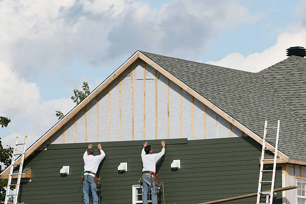 Professional Storm Damage Siding Repair technician working in Forest City, FL
